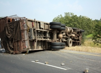 an overturned semi truck on the highway after a crash