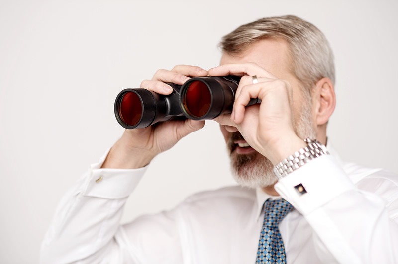 private investigator holding binoculars