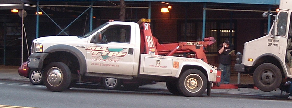 tow truck hitching delivery truck
